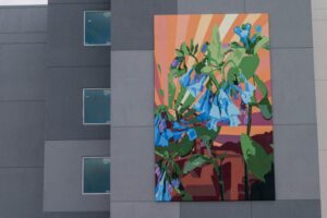 Floral mural on a building, showcasing a variety of flowers