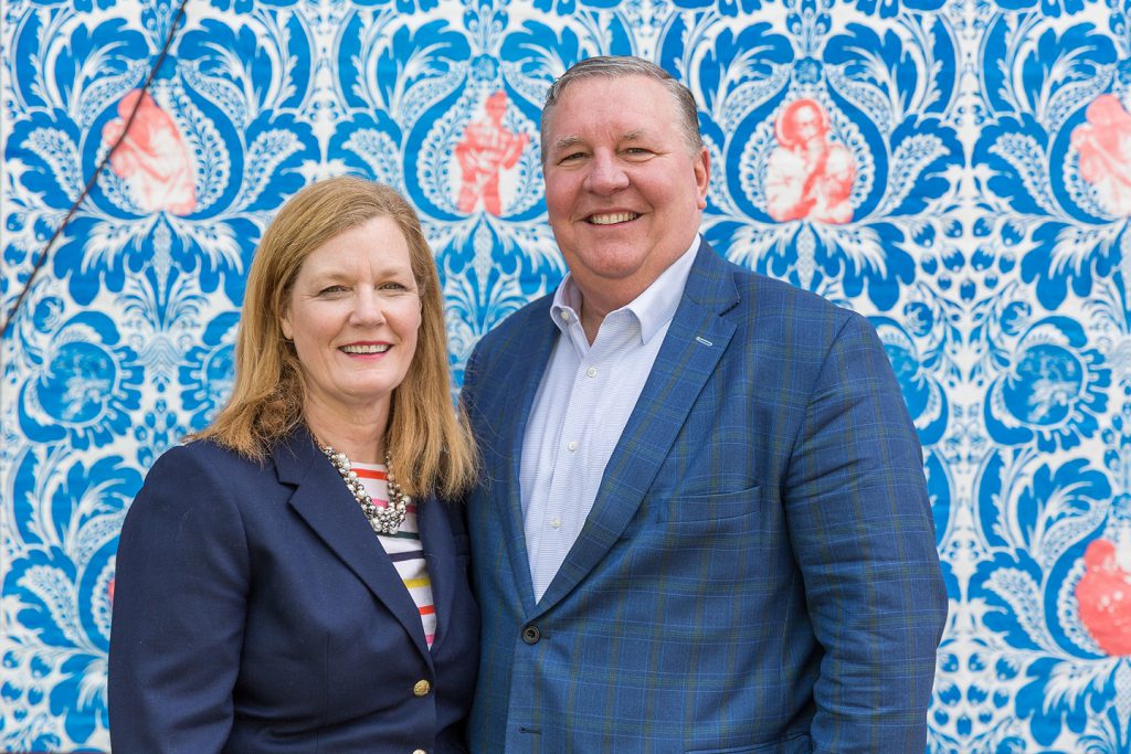 Jenny Powell and Jamie Smith in front of the Terrance Hammond's New Lines Mural