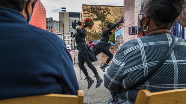 Qkidz performing at ArtWorks Time Saved vs. Time Served Mural dedication. Photo by Louis Rideout.