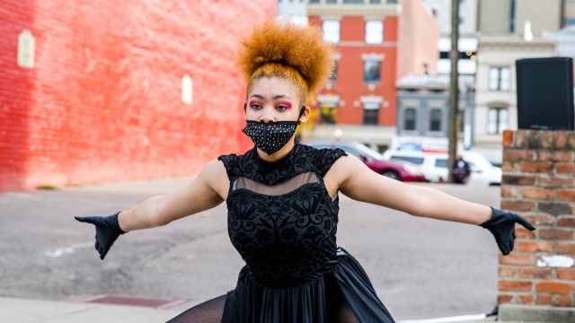 Qkidz performing at ArtWorks Time Saved vs. Time Served Mural dedication. Photo by Louis Rideout.