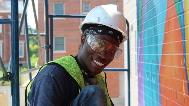 Senior Apprentice, LaDe Richardson working on mural.