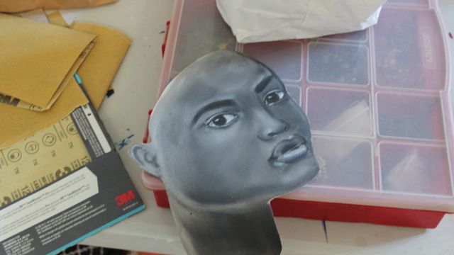 The Way We See Ourselves Gallery Team works with April Sunami. Photo by Sandra Okot-Kotber. The Way We See Ourselves Gallery Team April Sunami