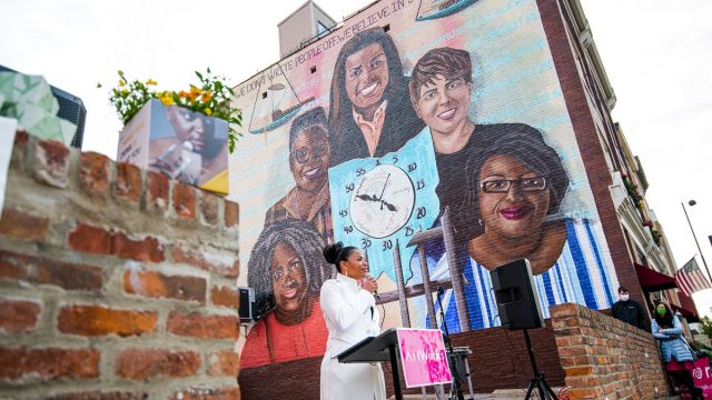 Tyra Patterson speaking at the ArtWorks Time Saved vs. Time Served Mural dedication. Photo by Louis Rideout.